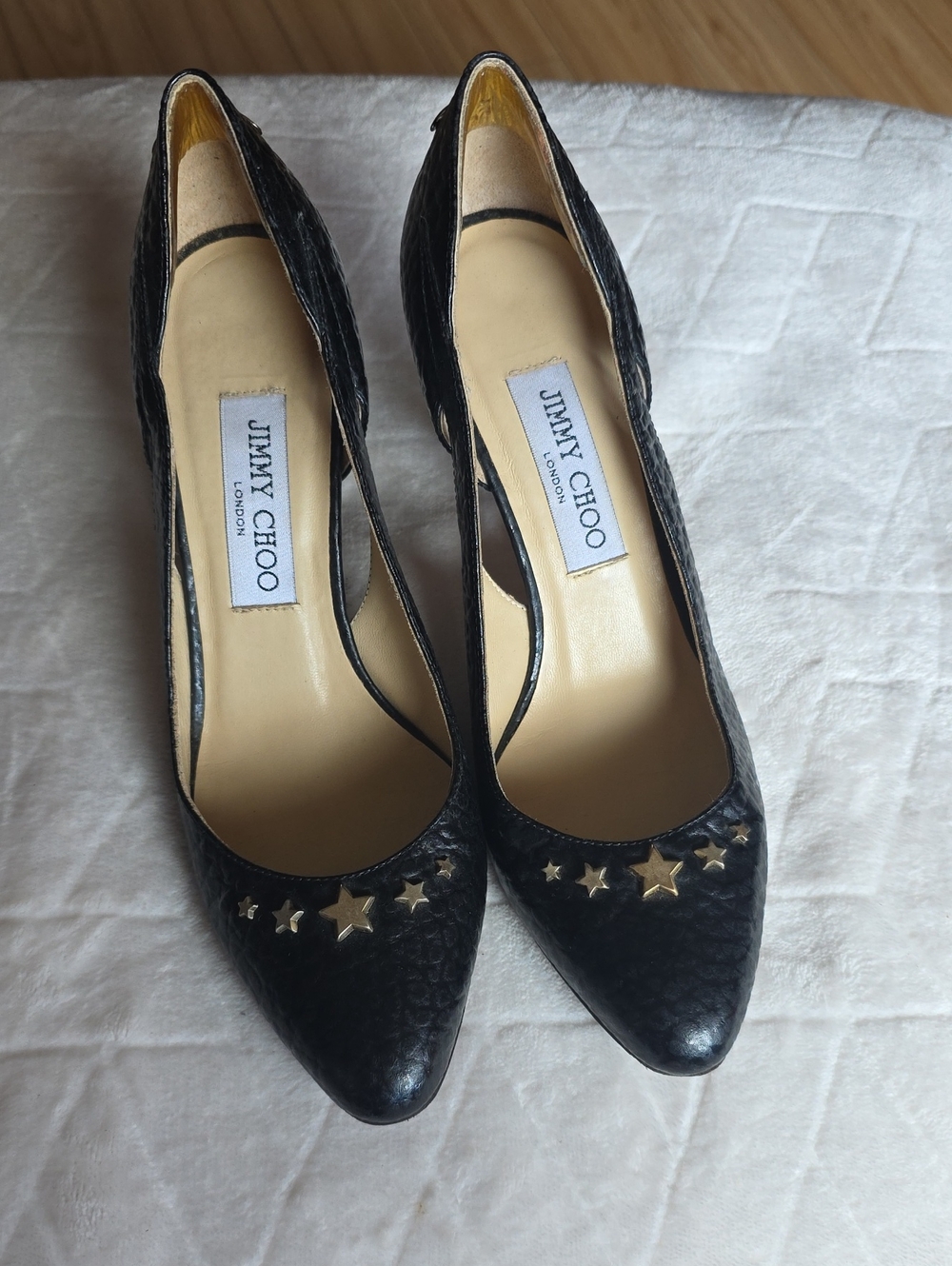 Jimmy Choo Black Pointed Toe Pumps with Gold Star Accents